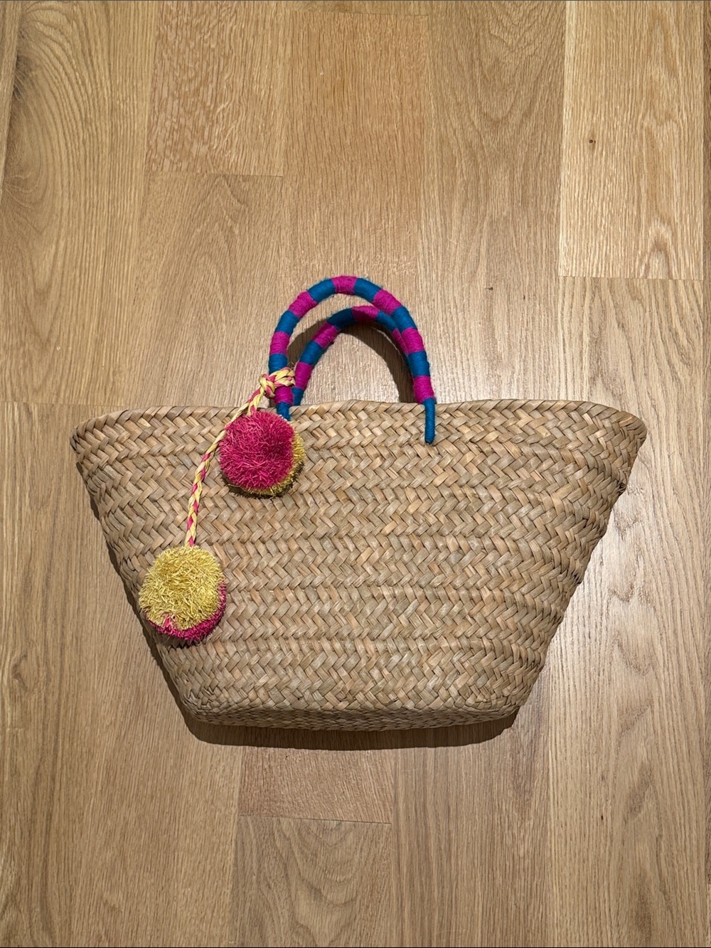 Woven Straw Tote with Pink & Yellow Pom-Pom Accents